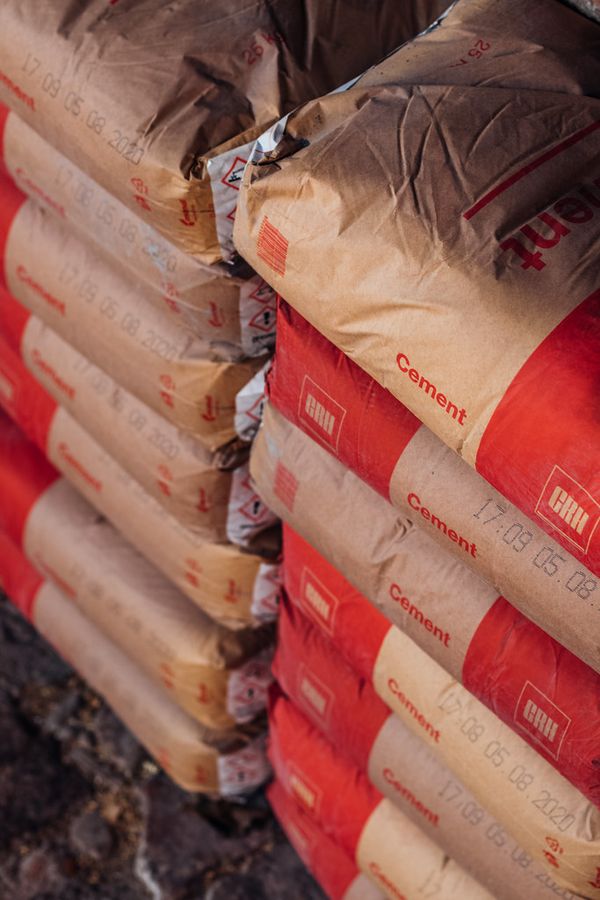 Stacked cement bags in supply yard